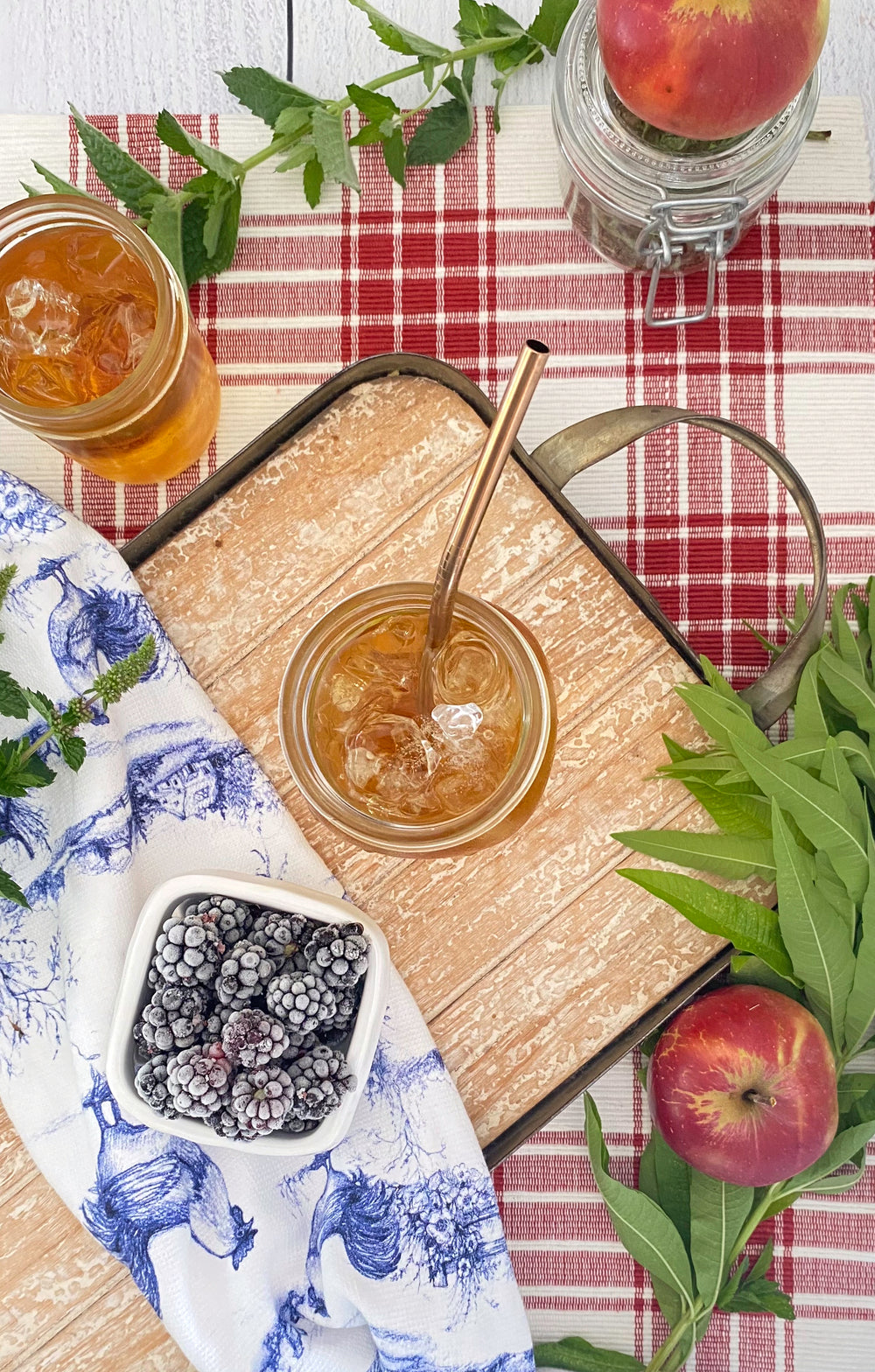 Jars of Mint Tea on Plaid Tablecloth with Fresh Mint