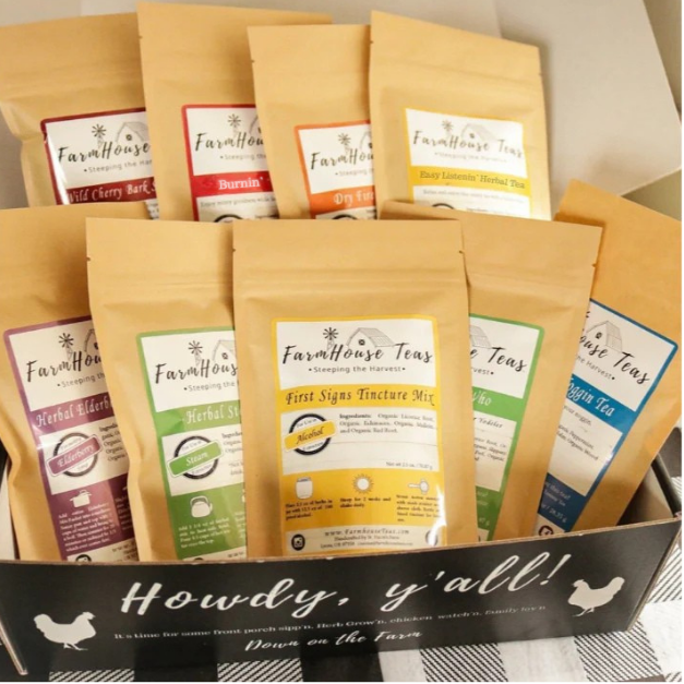 Assorted tea bags in colorful packaging on a white background