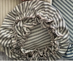 Collection of striped fabric headbands on a wooden surface