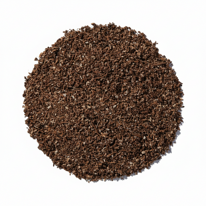 A top-down view of a pile of dark brown dandelion granules
