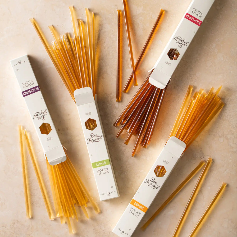 Honey sticks with packaging on a beige background