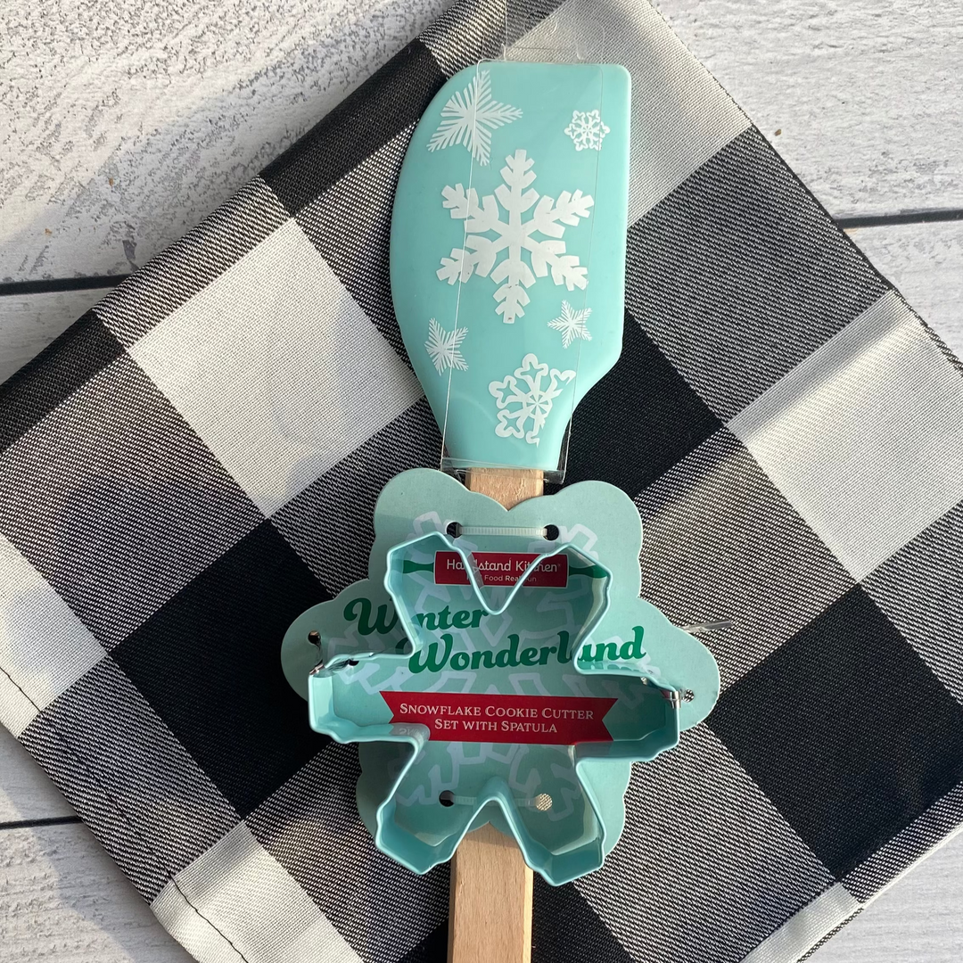 Spatula with snowflake design and 'Winter Wonderland' text on a checkered cloth.