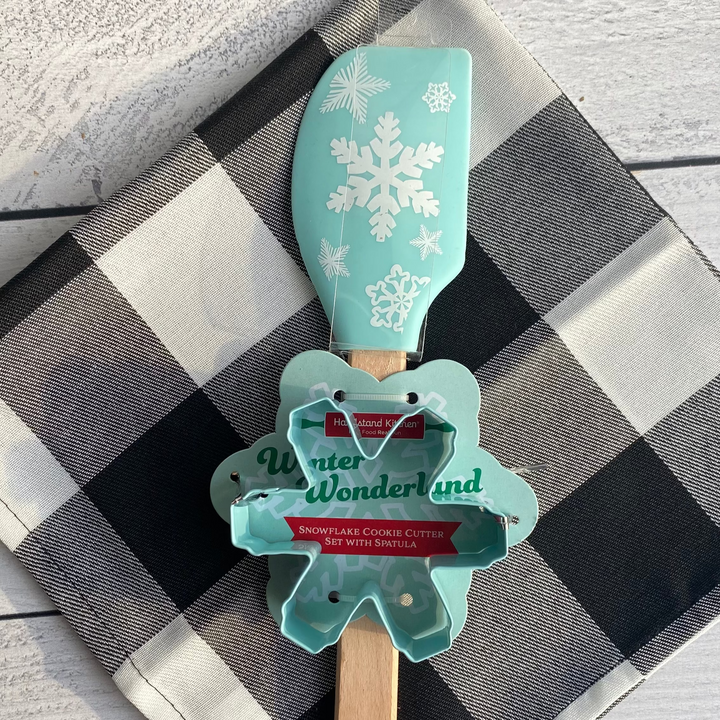 Spatula with snowflake design and 'Winter Wonderland' text on a checkered cloth.